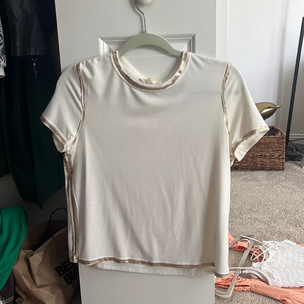 White and gold soft current air top